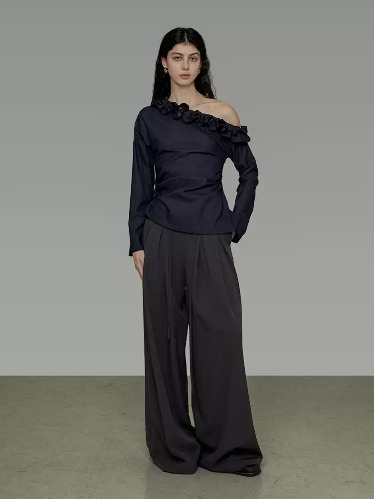 A woman in a lace collar off-the-shoulder shirt