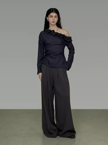 A woman in a lace collar off-the-shoulder shirt