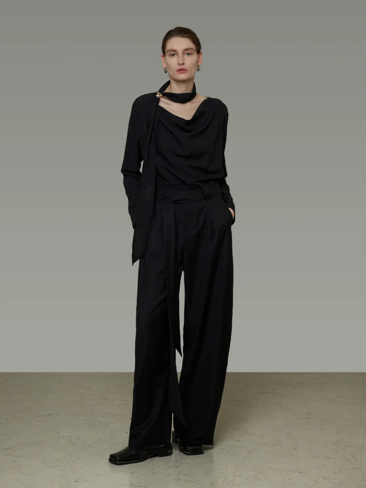 A stylish V-neck shirt with a flowing ribbon