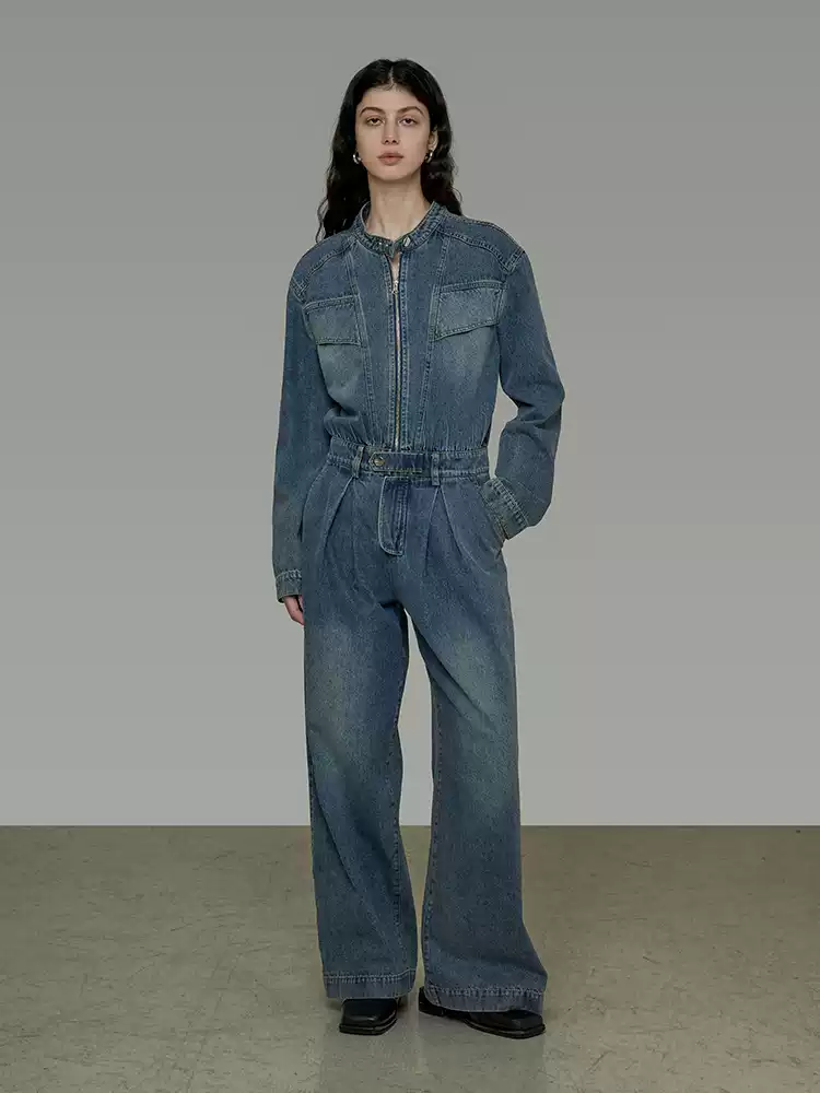 A woman in a retro and high-end denim jumpsuit