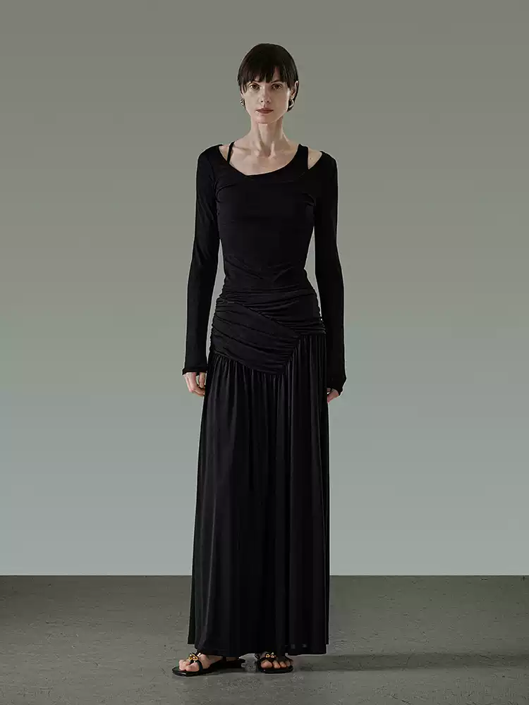 A pleated and draping skirt at the waist
