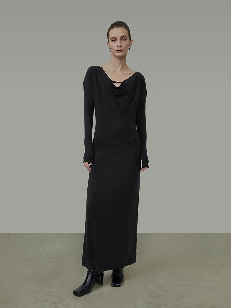 A knitted long dress with a cinched waist and slimming design