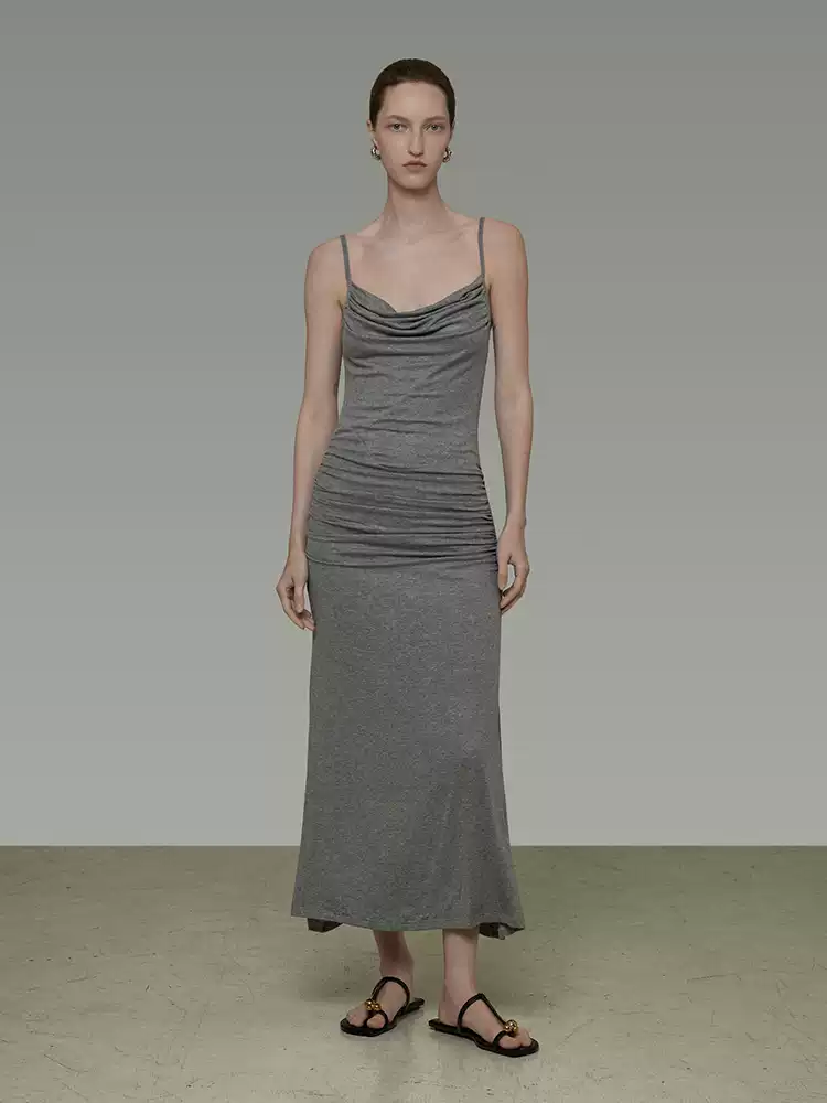 A figure-hugging pleated halter dress with a neckline design