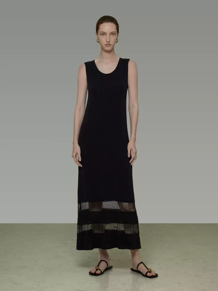 A high-end long dress with a stylish tassel hem