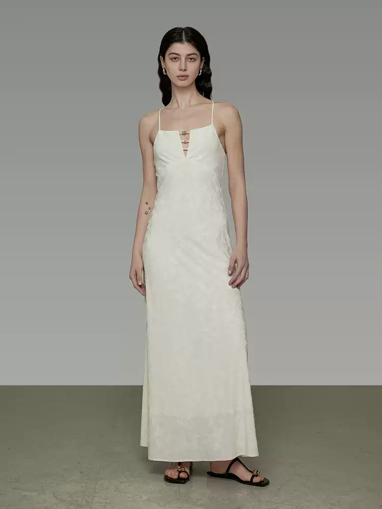 A woman in a styled neckline halter dress