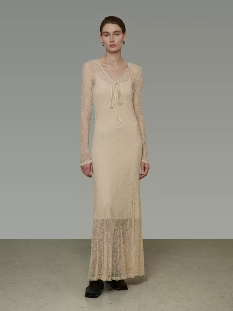 A woman in a slightly transparent V-neck dress