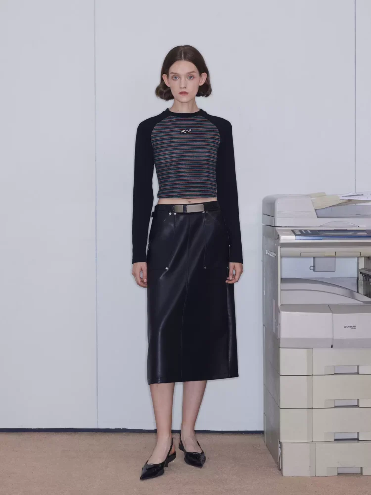 A slim and slimming mid-length leather skirt for women