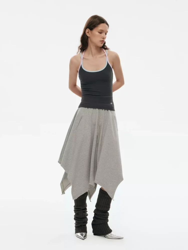 a woman in an irregularly fringed A-line skirt