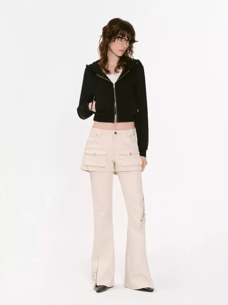 A woman wearing two pairs of reverse cargo pants