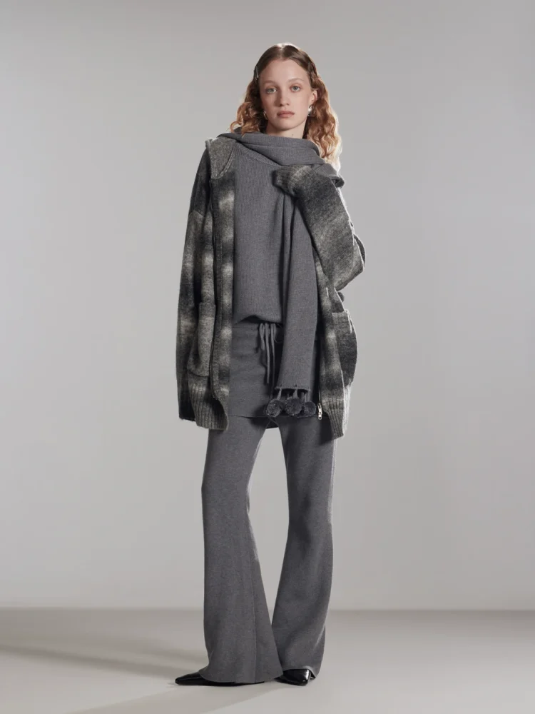 A woman wearing two fake cashmere knitted culottes