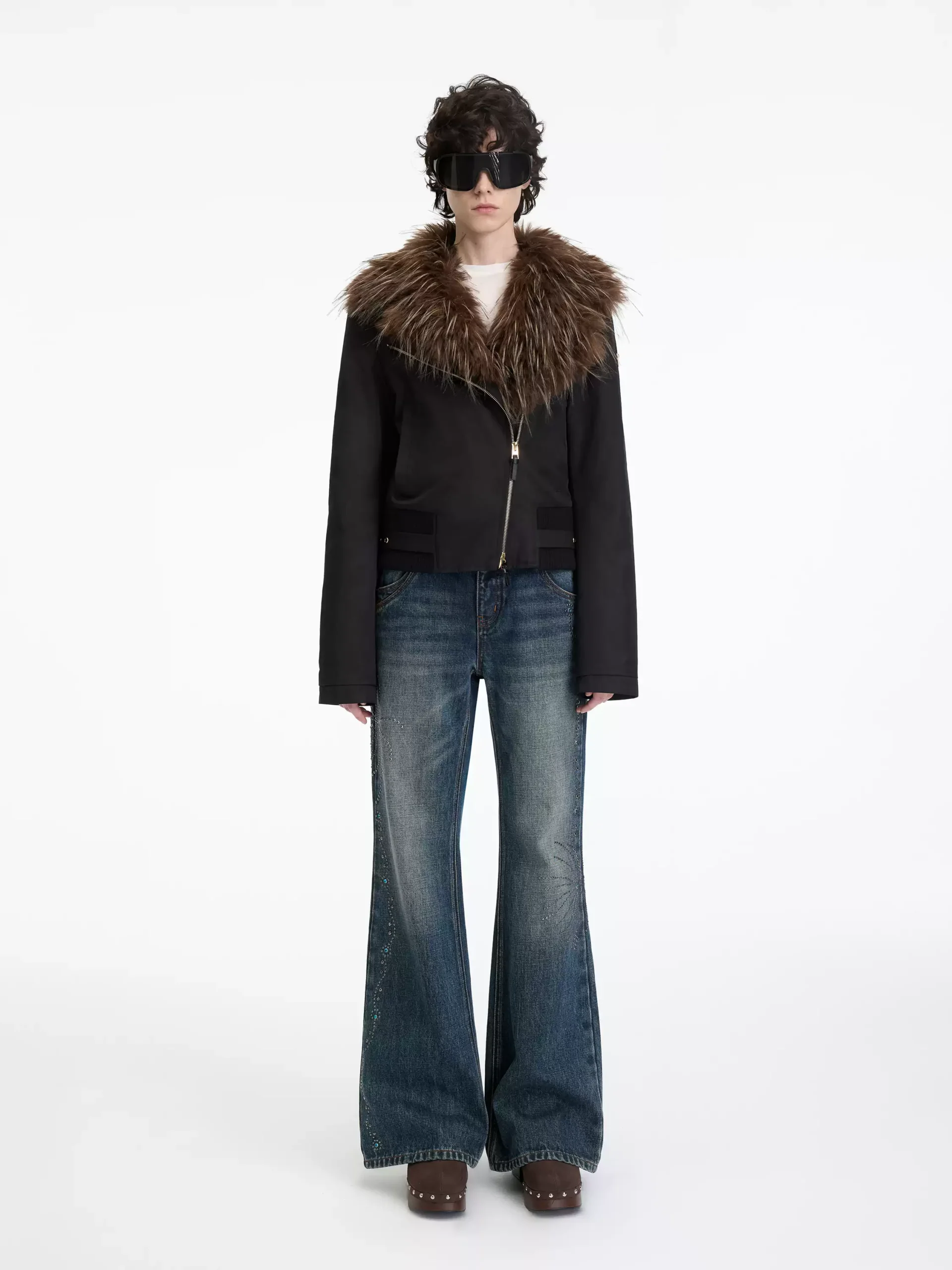 Women's mid-waisted, slightly flared jeans with rivets