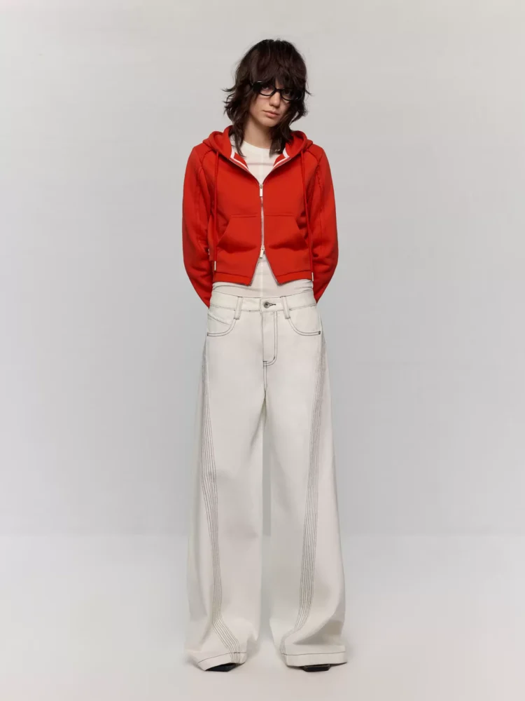 A woman in white jeans with clear lines