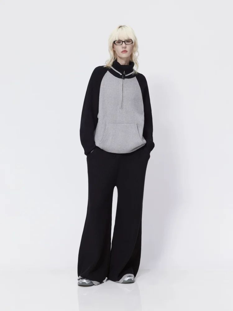 A large lapel off-the-shoulder sweater coat