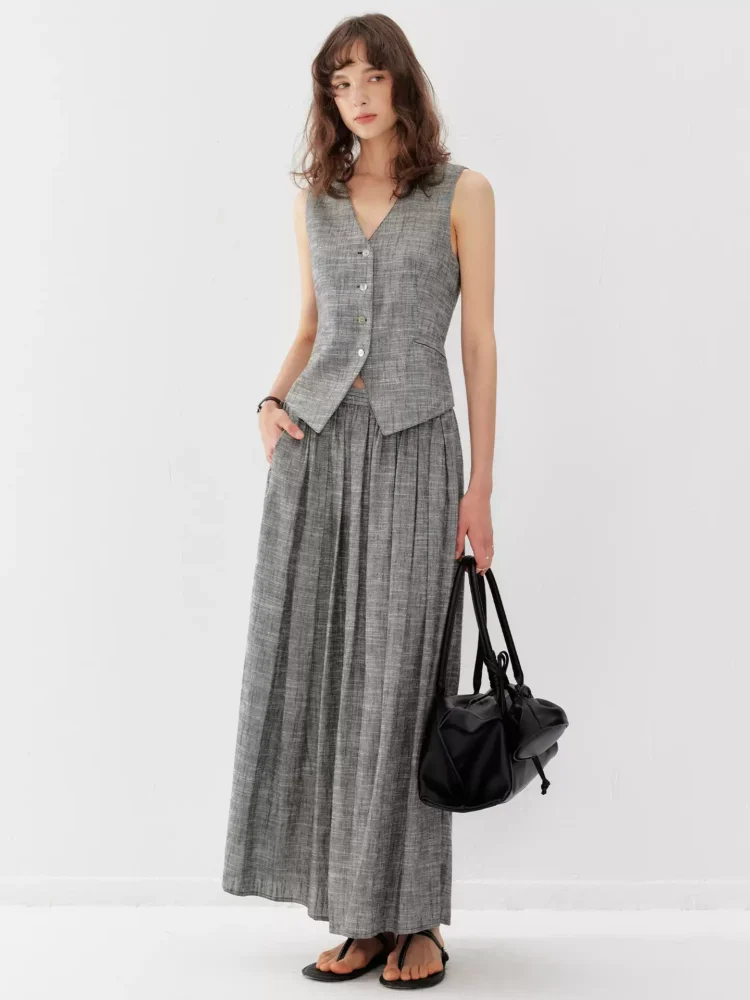 A linen vest suit with a large skirt hem