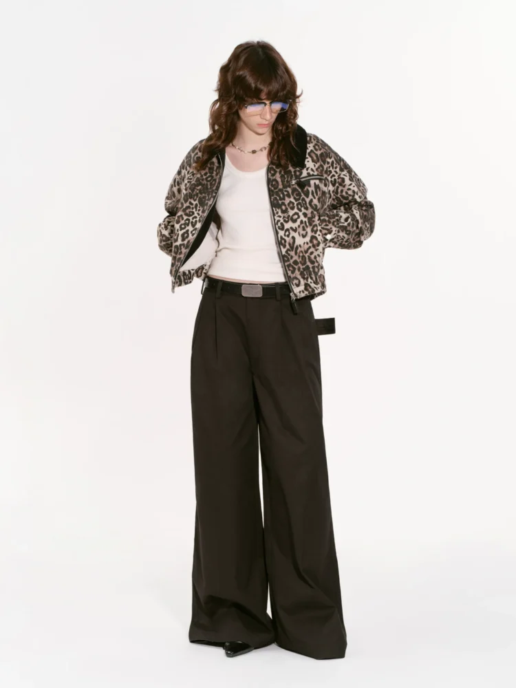 A woman in a leopard print coat on the street