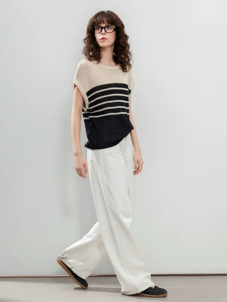 A striped knitted sweater with a hollowed-out design