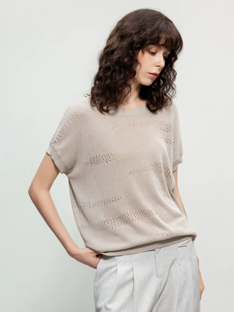 A woman wearing a retro perforated sweater