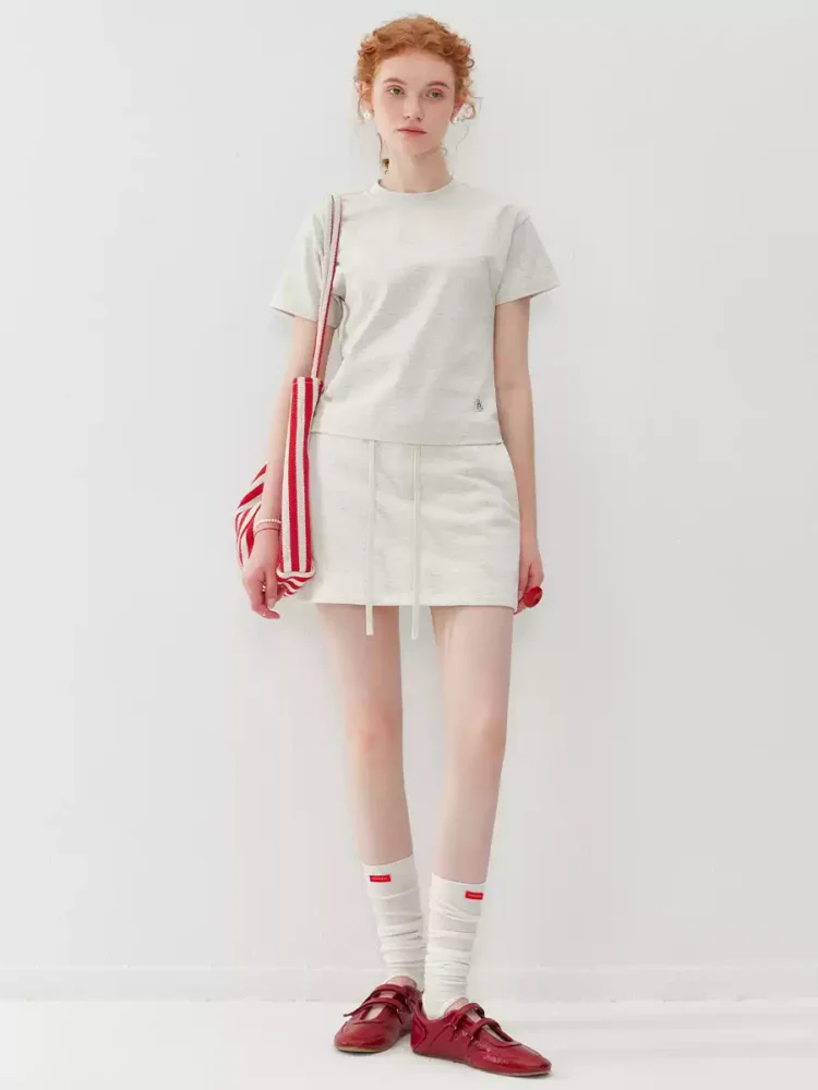 A two-piece set of round-neck T-shirt and sports short skirt