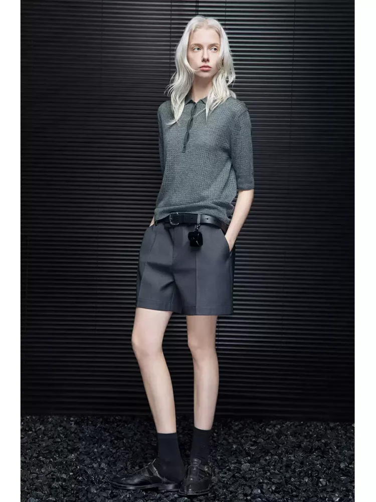 A woman in loose grey high-end shorts