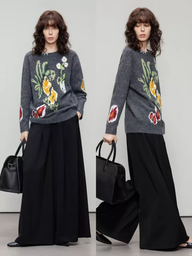 A woman in a color-blocking floral jacquard sweater