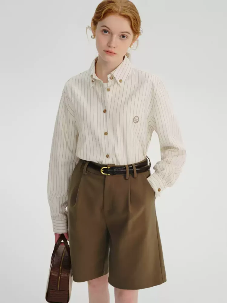 A woman in a striped linen shirt