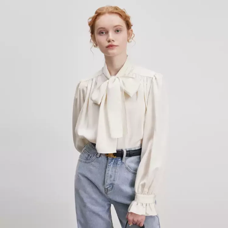 A woman in a bow shirt