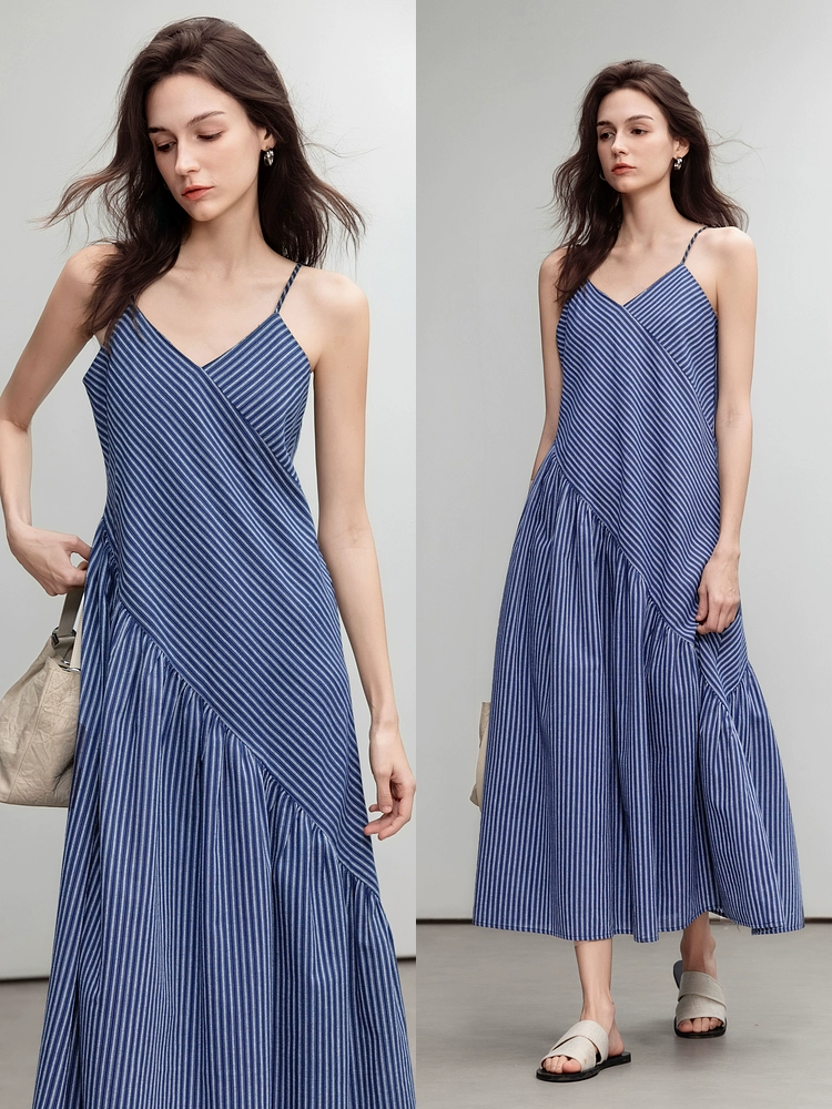 A woman in a striped halter dress