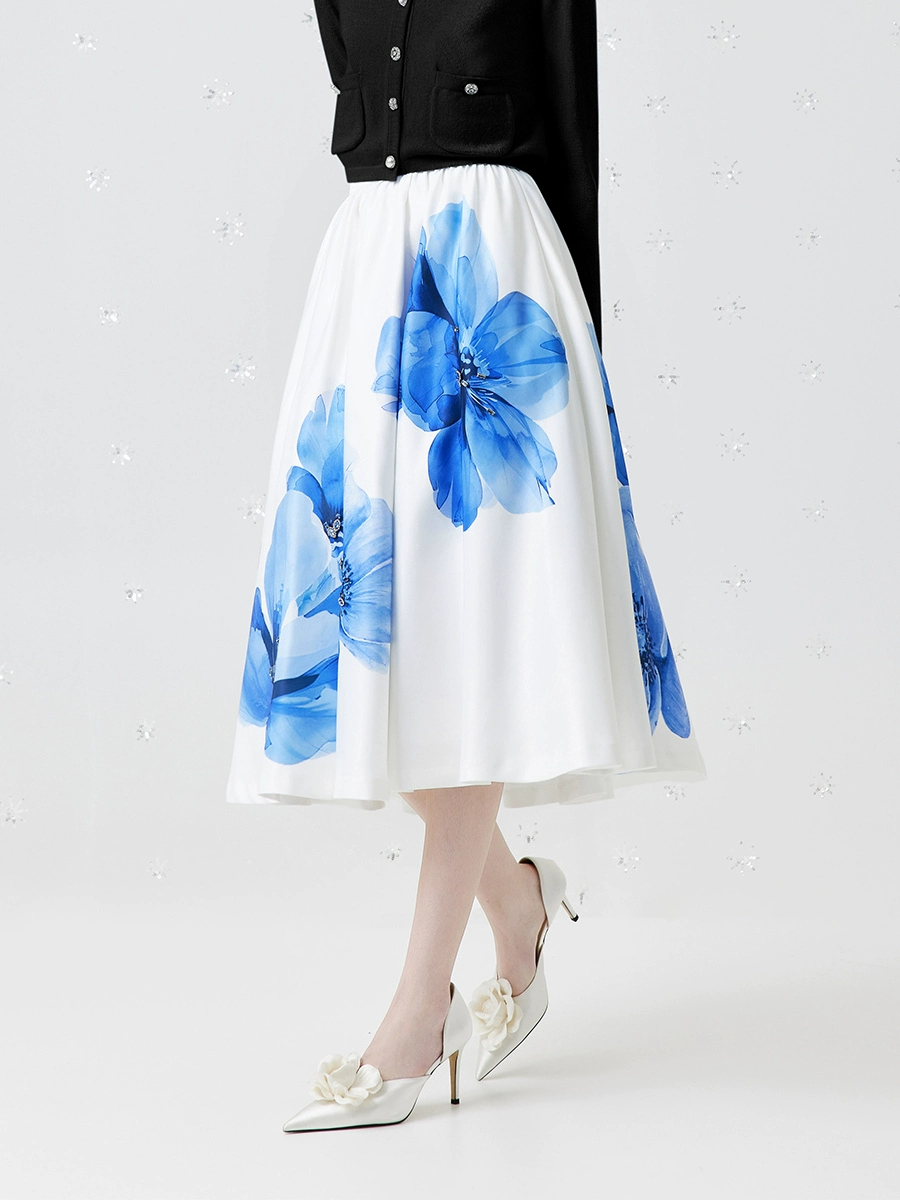 a long white A-line skirt with floral patterns